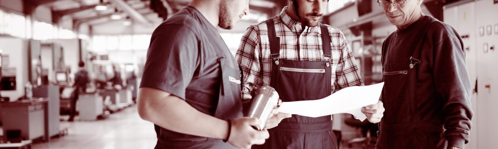 Lathe Metalwork Production Lathe Metalwork Production Line. Caucasian Worker Preparing Machine To Work.