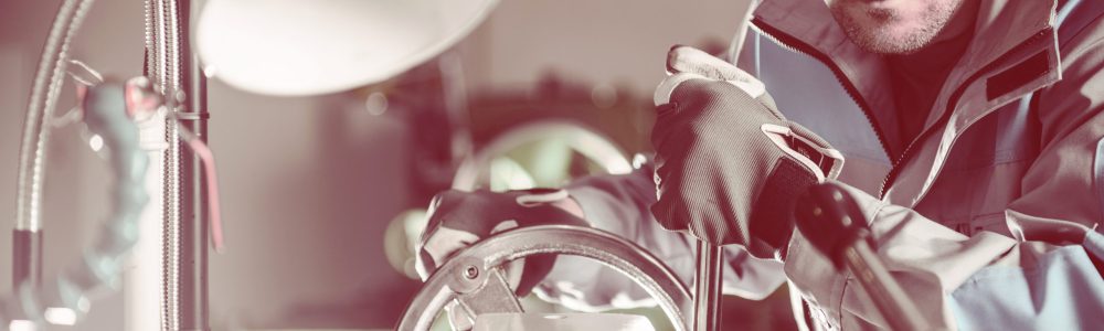 Lathe Metalwork Production Lathe Metalwork Production Line. Caucasian Worker Preparing Machine To Work.